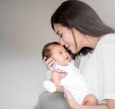 beautiful-woman-holding-newborn-baby-her-arms (1)